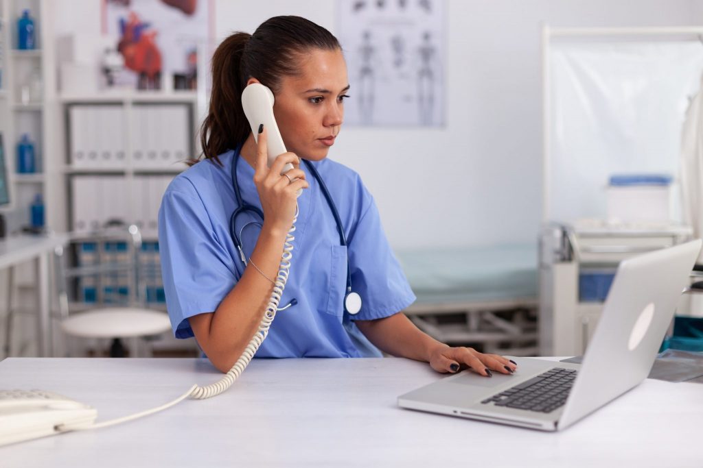 Health care worker making a phone call